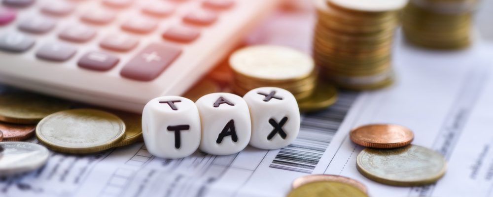 tax words calculator stacked coins invoice bill paper time tax filling